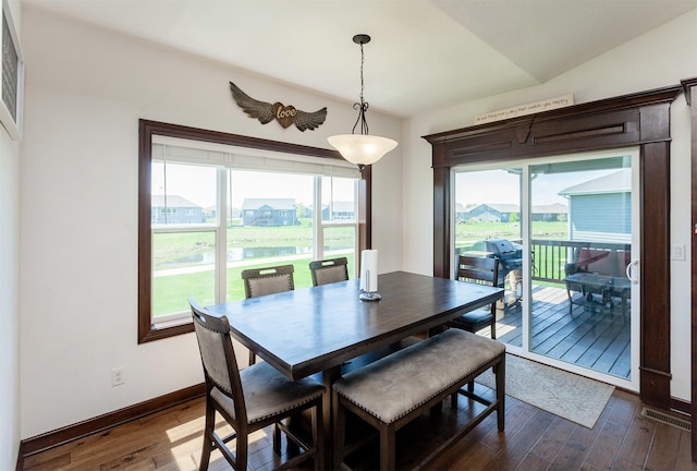 218 34th St SE, Altoona, IA 50009 - dining space with dark wood-type flooring, baseboards, and a water view
