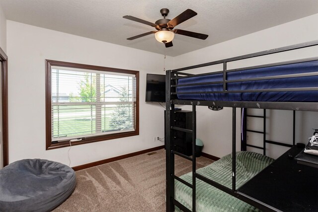 218 34th St SE, Altoona, IA 50009 - carpeted bedroom featuring baseboards and a ceiling fan