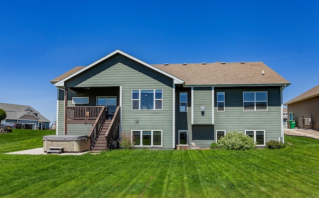 218 34th St SE, Altoona, IA 50009 - rear view of property with a hot tub, a yard, roof with shingles, and stairway