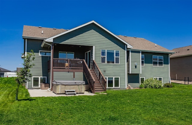 218 34th St SE, Altoona, IA 50009 - back of property featuring a hot tub, a patio, and a lawn