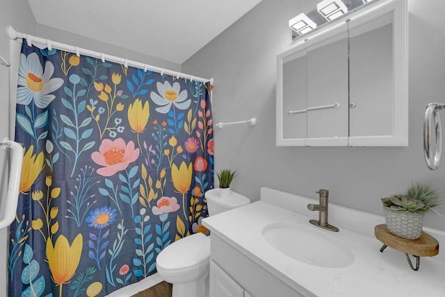 full bath featuring vanity, toilet, a textured ceiling, and a shower with shower curtain