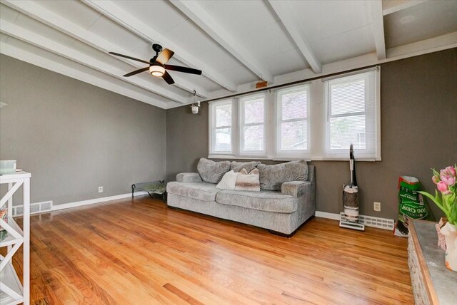 4132 69th St, Urbandale, IA 50322 - living area with beam ceiling, light wood-style flooring, ceiling fan, and baseboards