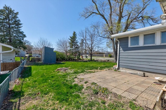 4132 69th St, Urbandale, IA 50322 - view of yard featuring a storage unit, an outbuilding, and a patio