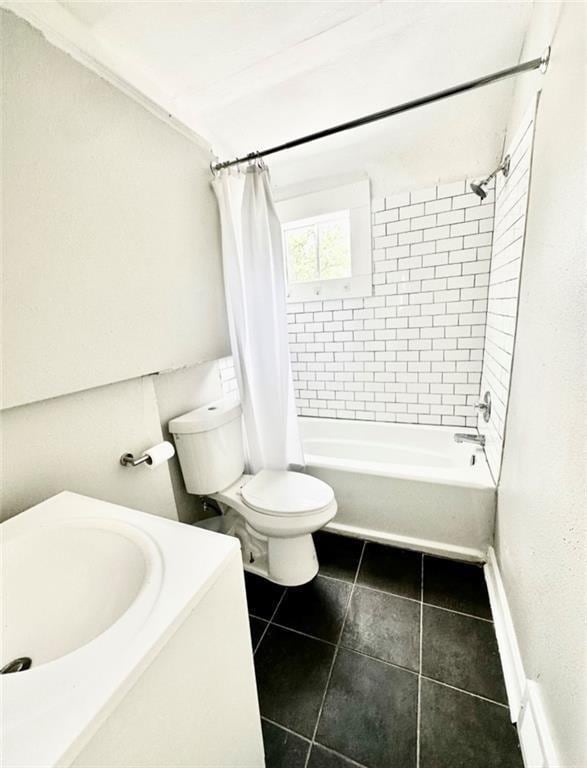 full bathroom featuring vanity, toilet, tile patterned flooring, and shower / tub combo