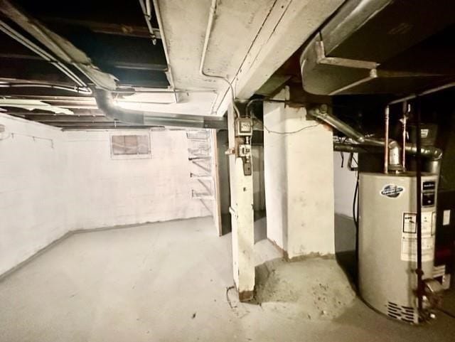 unfinished basement with gas water heater