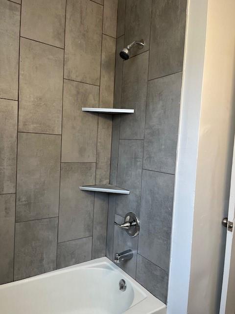 full bath featuring shower / bathing tub combination
