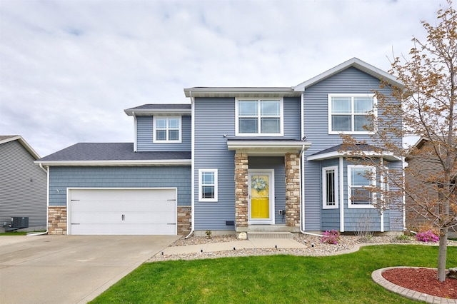 1009 NW Orchard Dr, Ankeny, IA 50023 - view of front of home with central AC unit, a front lawn, stone siding, and concrete driveway
