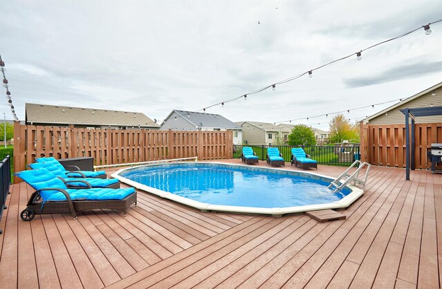 1009 NW Orchard Dr, Ankeny, IA 50023 - view of pool with fence, a wooden deck, and a fenced in pool