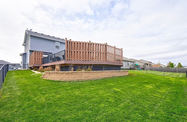 1009 NW Orchard Dr, Ankeny, IA 50023 - rear view of house with a lawn, a wooden deck, a fenced backyard, and a playground