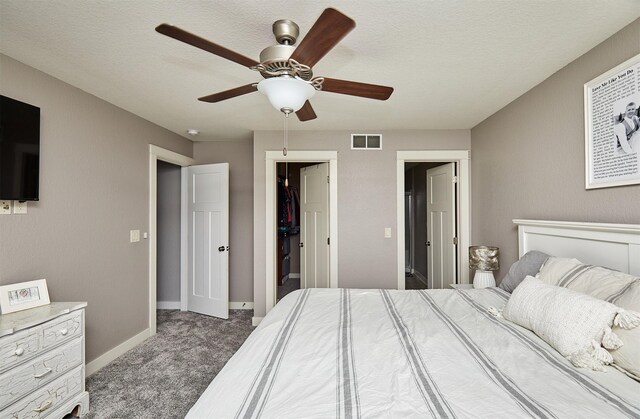 1009 NW Orchard Dr, Ankeny, IA 50023 - carpeted bedroom featuring visible vents, a ceiling fan, baseboards, and a textured ceiling