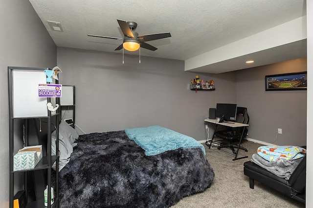 carpeted bedroom featuring ceiling fan, visible vents, and baseboards