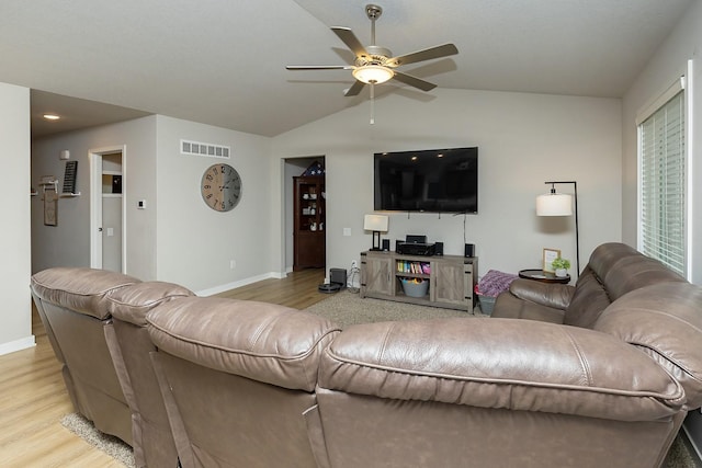 living room featuring a ceiling fan, baseboards, visible vents, and light wood-type flooring