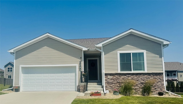 2500 N 7th Ave E, Newton, IA 50208 - single story home featuring driveway, a garage, stone siding, and entry steps