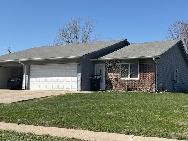 single story home featuring a garage, concrete driveway, a front lawn, and brick siding