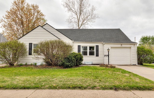 view of front of home with a garage, roof with shingles, driveway, and a front lawn
