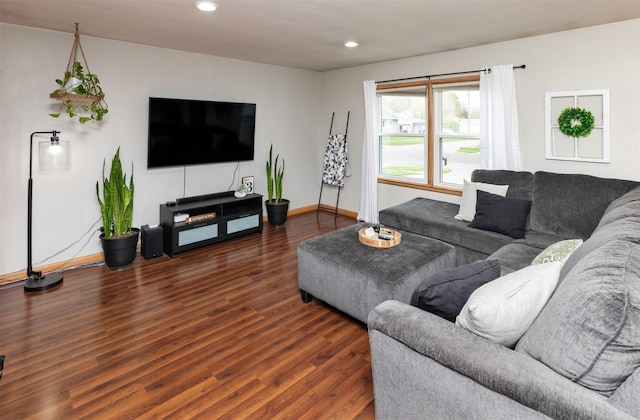 living room featuring baseboards, recessed lighting, and wood finished floors