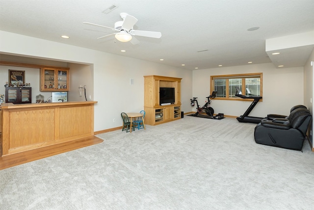 workout room with carpet floors, recessed lighting, and indoor wet bar