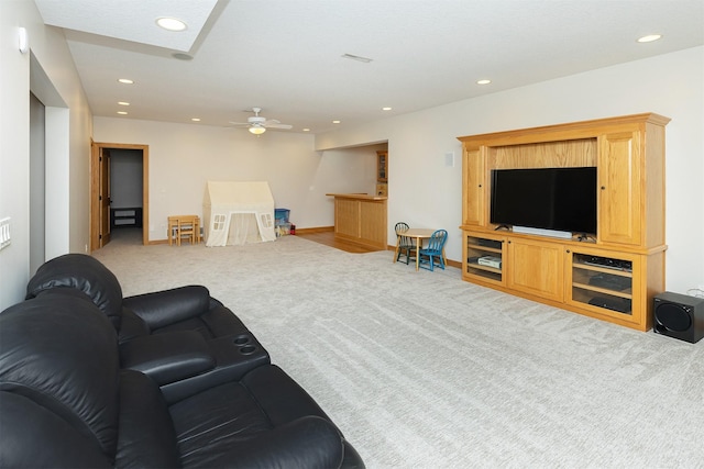 carpeted living room with baseboards, ceiling fan, and recessed lighting