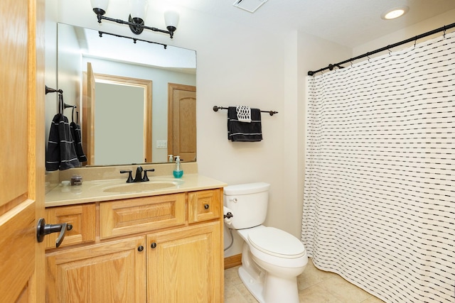 full bath with tile patterned flooring, curtained shower, toilet, and vanity