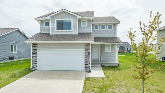 craftsman house featuring central air condition unit, a shingled roof, a front yard, and a garage
