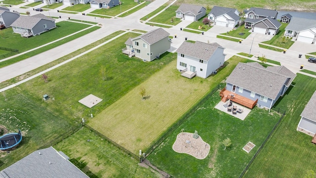 birds eye view of property with a residential view