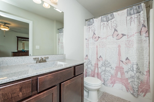 full bathroom with a ceiling fan, curtained shower, vanity, tile patterned floors, and toilet