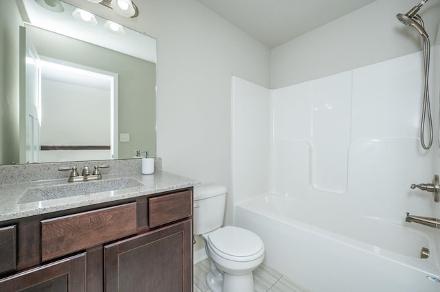 bathroom featuring toilet, washtub / shower combination, and vanity