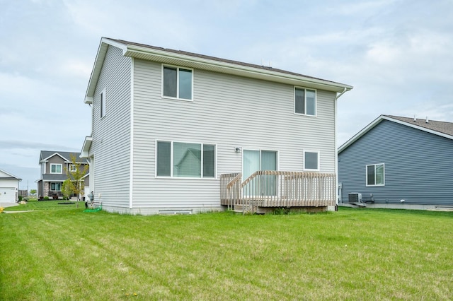back of house with a yard and a wooden deck