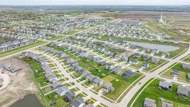 bird's eye view with a water view and a residential view