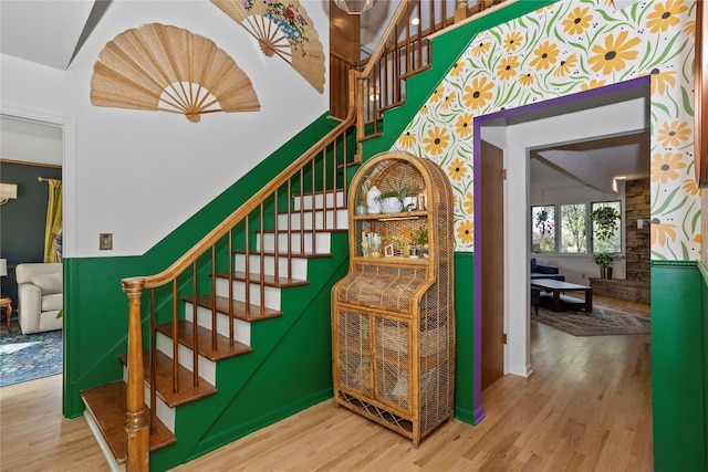 staircase with wood finished floors