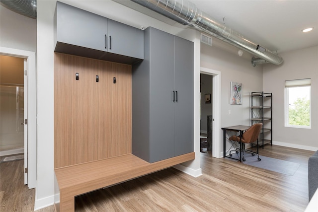 mudroom with recessed lighting, baseboards, visible vents, and light wood-style floors