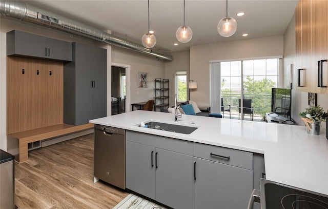 kitchen with gray cabinetry, a peninsula, recessed lighting, and dishwasher