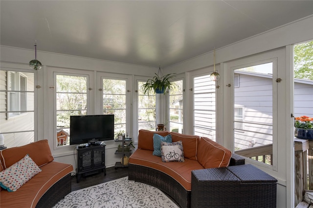 1233 24th St, West Des Moines, IA 50266 - sunroom with french doors, wood finished floors, and a wood stove