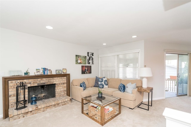 living room featuring a fireplace, baseboards, carpet, and recessed lighting