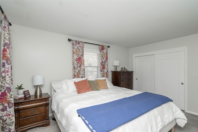 bedroom with carpet flooring and a closet