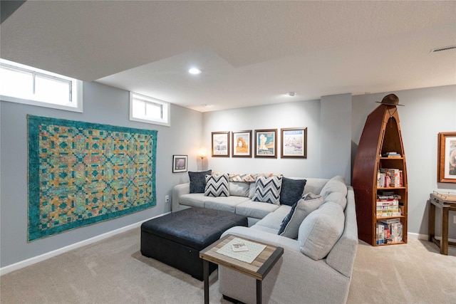 carpeted living room with baseboards, recessed lighting, and visible vents