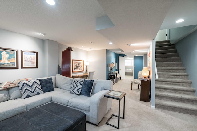living room featuring recessed lighting, light colored carpet, and stairway