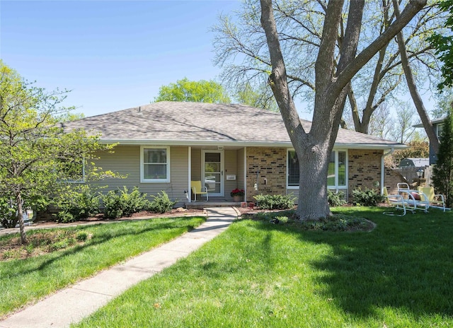1233 24th St, West Des Moines, IA 50266 - ranch-style home with a front lawn, covered porch, roof with shingles, and brick siding