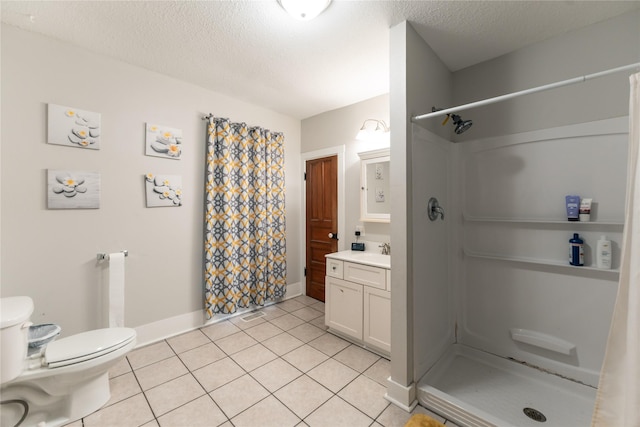 full bath with vanity, baseboards, a stall shower, and toilet