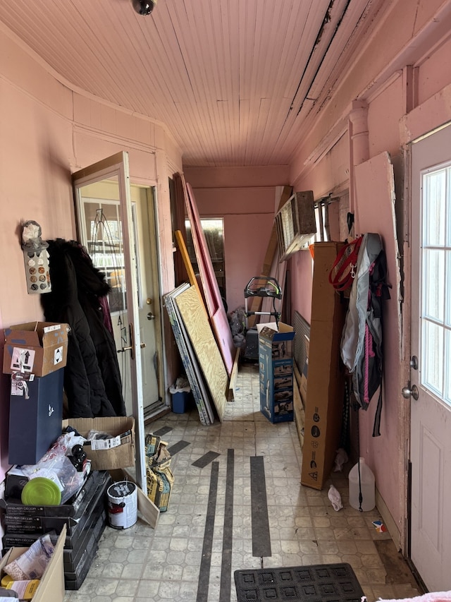 miscellaneous room with wooden ceiling and light floors