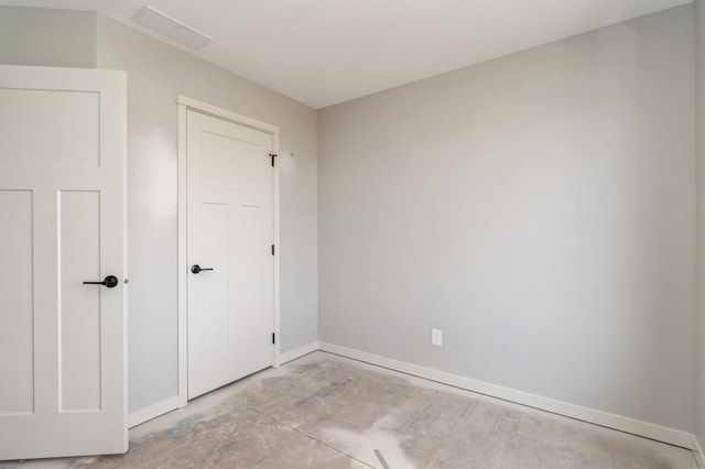 unfurnished bedroom with baseboards and visible vents