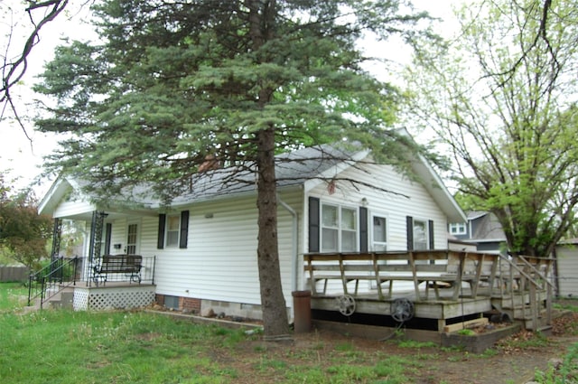 view of front of house featuring a deck and crawl space