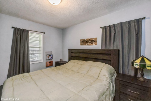 bedroom featuring a textured ceiling