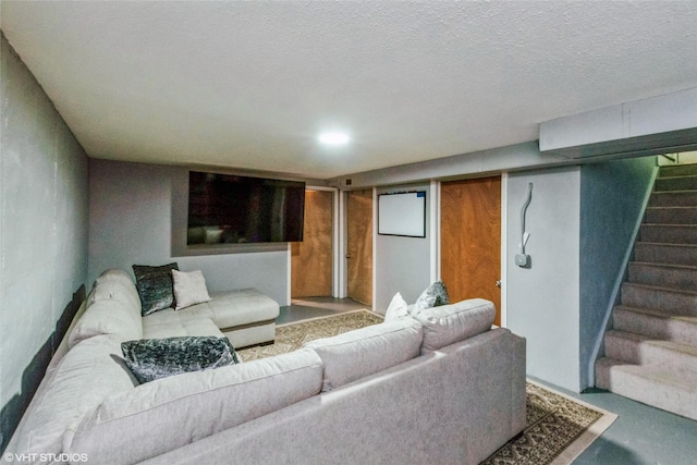 living area with stairs and finished concrete floors