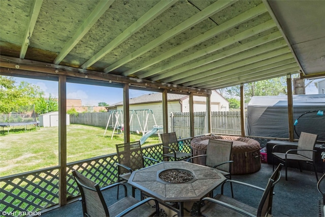 sunroom with a fire pit
