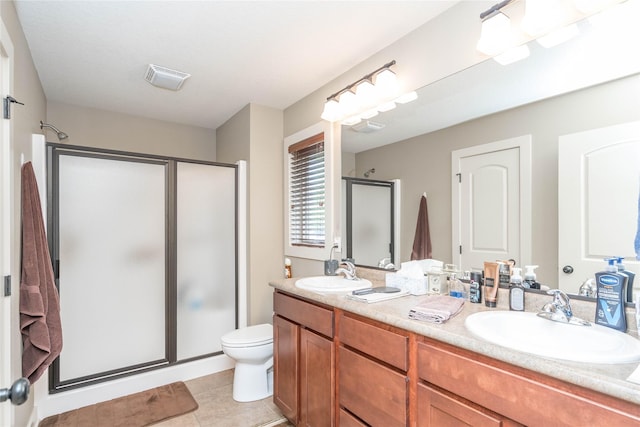 full bath featuring a sink, a shower stall, double vanity, and visible vents
