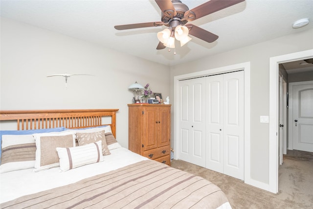 bedroom featuring ceiling fan, carpet, and a closet