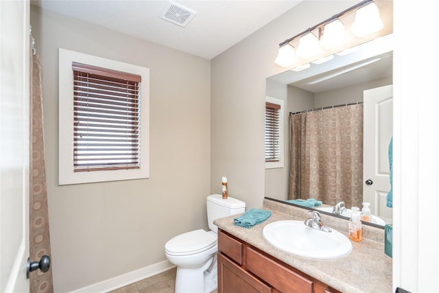 full bathroom featuring vanity, toilet, tile patterned floors, baseboards, and visible vents