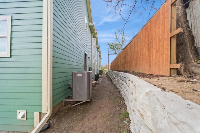 view of side of home featuring central AC unit