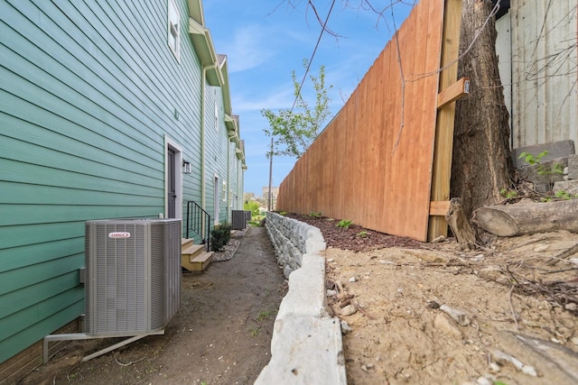 view of side of property with central AC